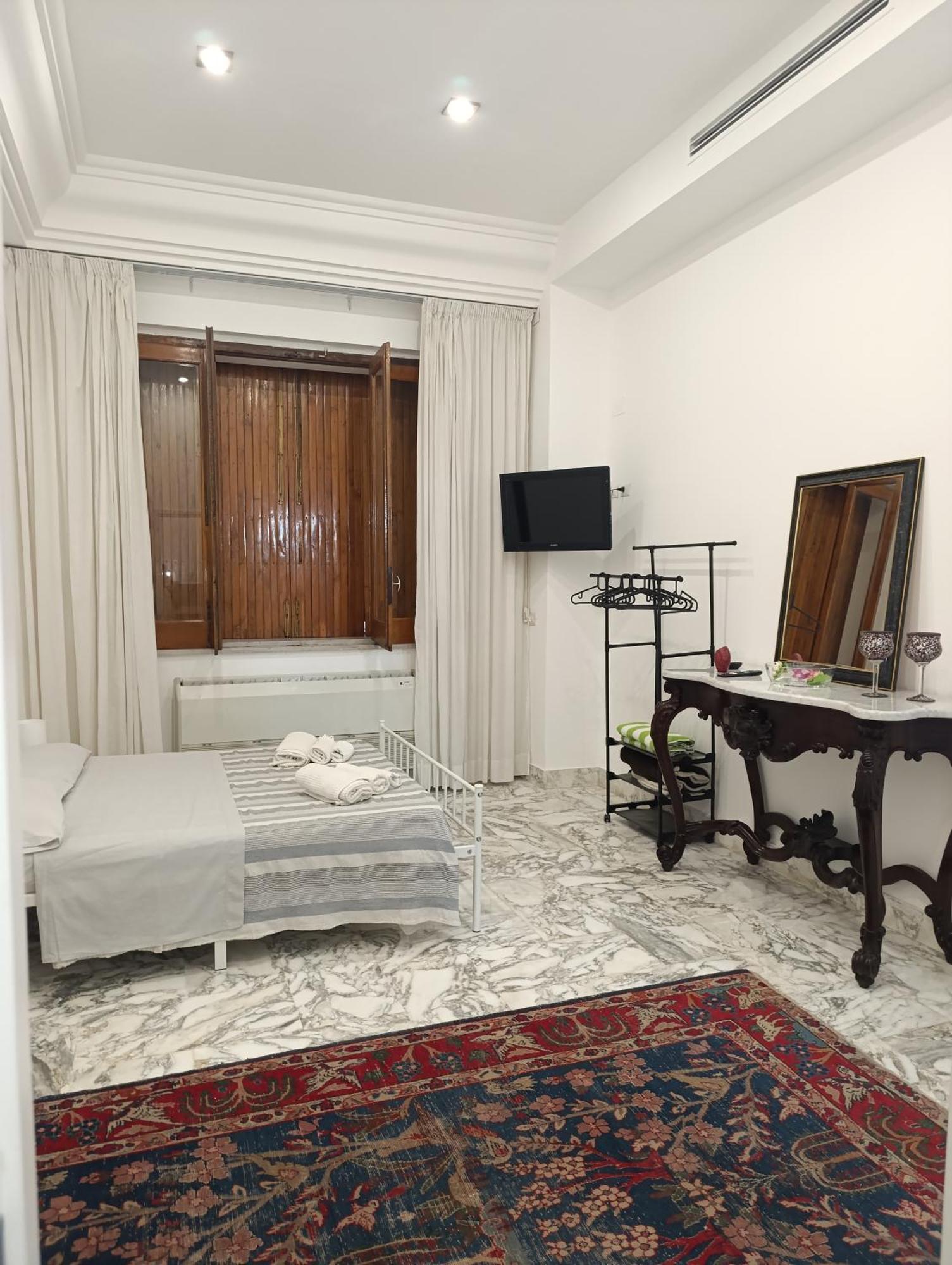Don Camillo Suites ريبوسْتو الغرفة الصورة